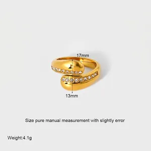 Detail showing 18k gold plated criss-cross ring dimensions 17mm x 13mm and 4.1g weight