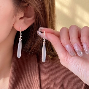 Elegant gold drop earrings with pearly white stones and cubic zirconia accents