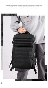 Close-up of black tactical backpack with Molle system webbing and durable handle