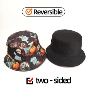 Reversible Halloween bucket hat with pumpkin skull print and solid black side