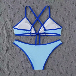 Detailed view of color-block halter bikini with lace-up back and removable chest pads