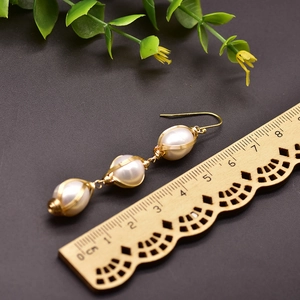 Three-pearl drop earrings with gold wire wrapping and 925 silver hooks, 7cm length