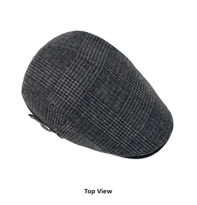 Top view of classic dark grey plaid flat cap with adjustable side buckle and wool texture