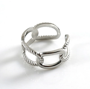 Detail of silver double-layered ring with chain and twisted rope woven texture