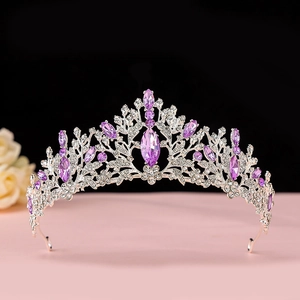 Macro shot of silver bridal crown featuring purple crystals and white cubic zirconia
