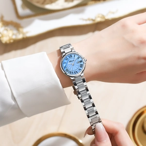 Elegant Chenxi silver steel watch for women with light blue Roman numeral dial on wrist
