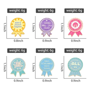 Detailed view of colorful enamel pins with humorous slogans and precise size measurements