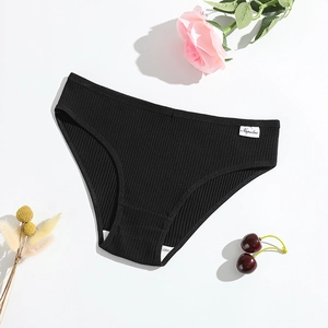 Women's black cotton ribbed briefs with low waist on white background with floral accents