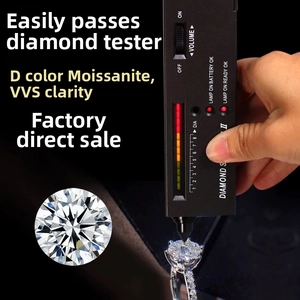 Close-up of D-color VVS moissanite ring and loose stone showing positive diamond tester result