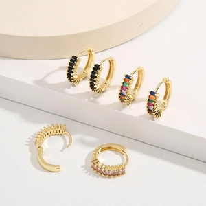 Detail of 18K gold-plated earrings with colorful baguette-cut cubic zirconia crystals