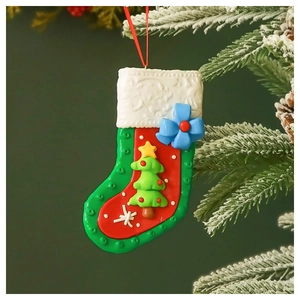 Christmas stocking pendant with 3D tree and blue bow hanging on a snowy branch