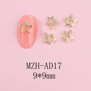 Detailed macro view of 9x9mm golden alloy star nail charms with rhinestones