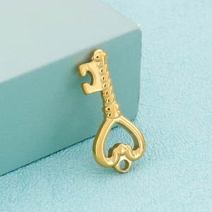 Gold stainless steel heart-shaped hollow key pendant on blue background