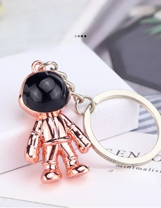 Macro detail of rose gold astronaut keychain made of durable zinc alloy material