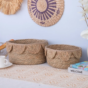 Handwoven Nordic rattan storage baskets with petal edges in natural seagrass style