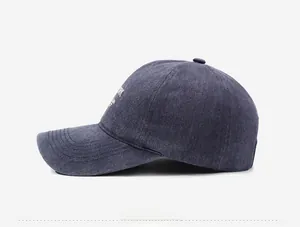 Detailed side view of washed cotton baseball cap featuring white New York embroidery