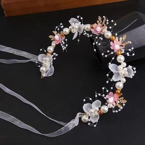 Elegant gold leaf bridal headband with pink flowers, white pearls and sheer ribbons
