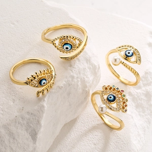 Gold plated evil eye ring set with blue resin, pearls and colorful zircon stones