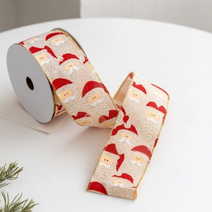 Christmas ribbon with Santa Claus print and golden glitter edges for holiday gift wrapping