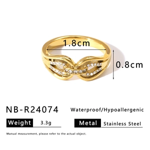Detailed view of a gold chain ring with white cubic zirconia and size measurements