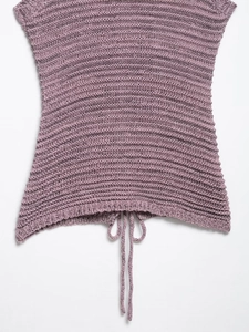 Detail of purple knitted sleeveless top with drawstring hem and textured fabric