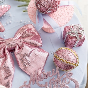 Pink Christmas ornaments set with glitter balls, bows and Merry Christmas sign