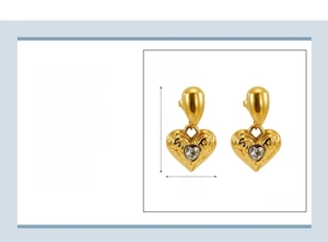 Detail view of 18k gold plated stainless steel heart earrings with zircon inlay