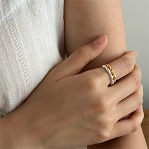 Minimalist S925 sterling silver olive bead rings set in matte gold and silver finishes