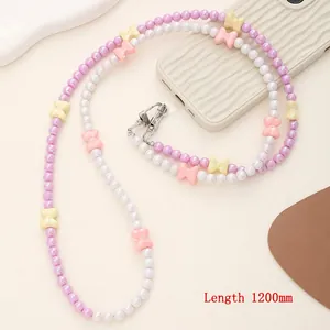 Detail of 1200mm crossbody phone lanyard with pink and white beads and butterfly charms