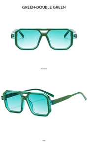 Detail view of double bridge aviator sunglasses with green frame and gradient lenses
