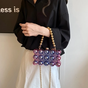 Iridescent purple acrylic bubble evening bag with gold beaded handle and chain strap