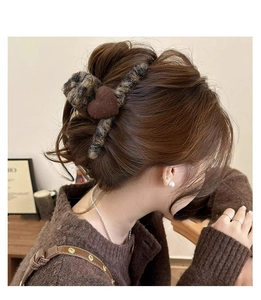 Brown flocking heart hair claw clip shown in hair for an elegant autumn hairstyle