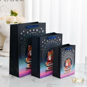 Three-piece Christmas gift bag set with Santa patterns and golden MERRY CHRISTMAS text