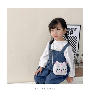 Close-up of a white PU leather cartoon cat crossbody bag for kids with pink ears and strap