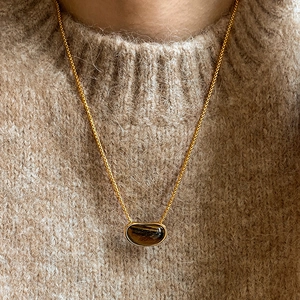 18k gold plated tiger eye stone pea pendant necklace worn on a cozy knit sweater