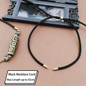 Detailed view of a 4mm black braided necklace cord with adjustable gold metal buckle