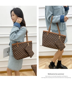 Detail view of large checkered tote bag with matching coin purse and gold hardware