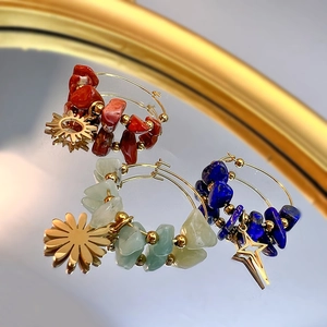 Bohemian crystal earrings set with sun leaf charms on gold stainless steel hoops