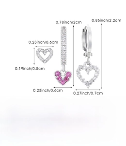 Detailed view of silver heart earrings set with purple stones and size measurements