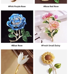 Detail view of colorful rose and daisy enamel brooches with crystals and gold plating