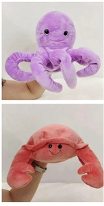 Detail of plush octopus and crab hand puppets for interactive parent-child storytelling