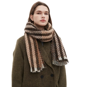 Chic brown and beige striped knit scarf for women, elegant winter accessory on model