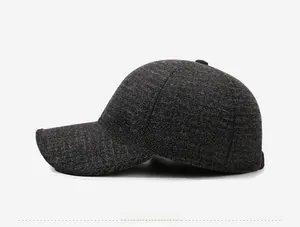 Detail of dark grey wool baseball cap showing thick texture and Fashion embossed logo