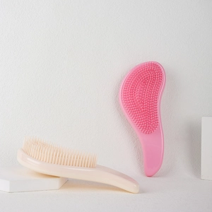 Pink and beige ergonomic detangling hairbrushes for wet and dry hair with soft bristles