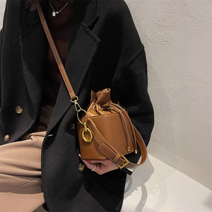 Vintage brown PU leather bucket bag with drawstring closure and golden hardware
