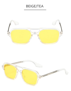 Detail of pilot sunglasses featuring a double bridge design and transparent beige tea lenses