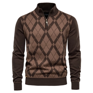 Close-up of men's argyle knit sweater featuring a 1/4 zipper and ribbed stand collar