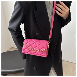 Detailed view of pink quilted PU leather crossbody bag with elegant gold chain strap