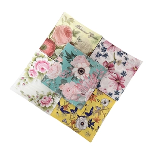 Floral printed paper napkins featuring vintage botanical garden designs with butterflies