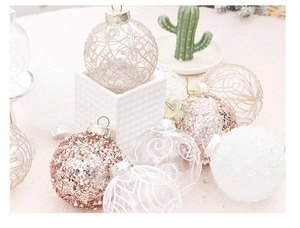 Detail view of 8cm clear hand-painted Christmas balls with gold sequins and glitter